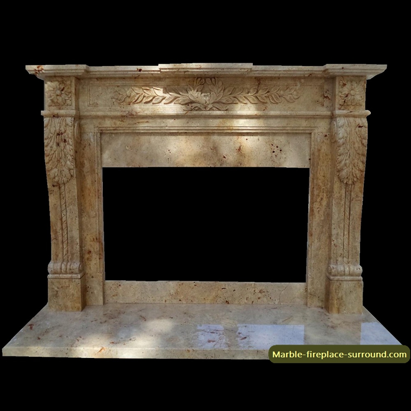 travertine fireplace with wreath relief